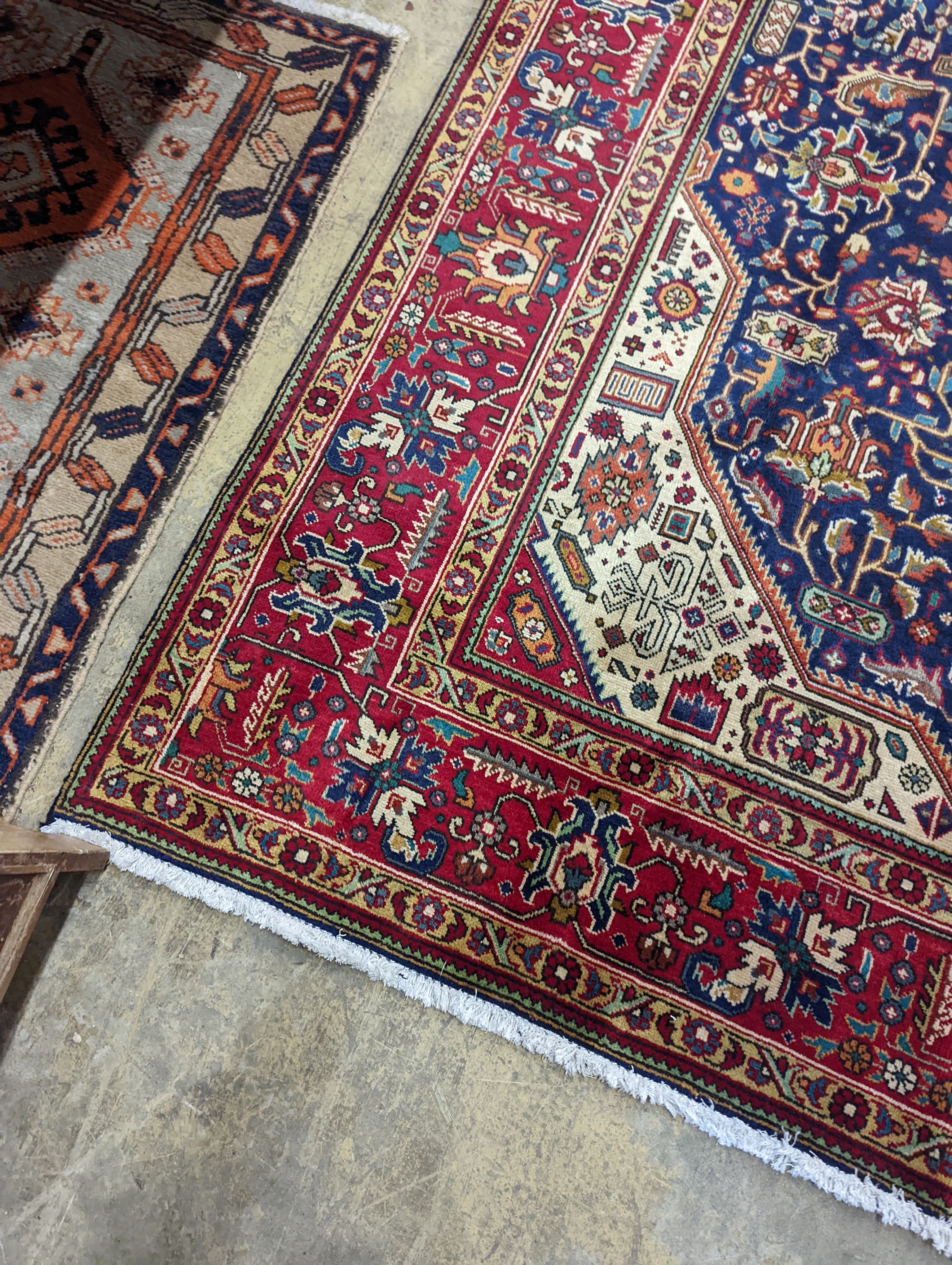 A Tabriz blue ground carpet, 290 x 200cm